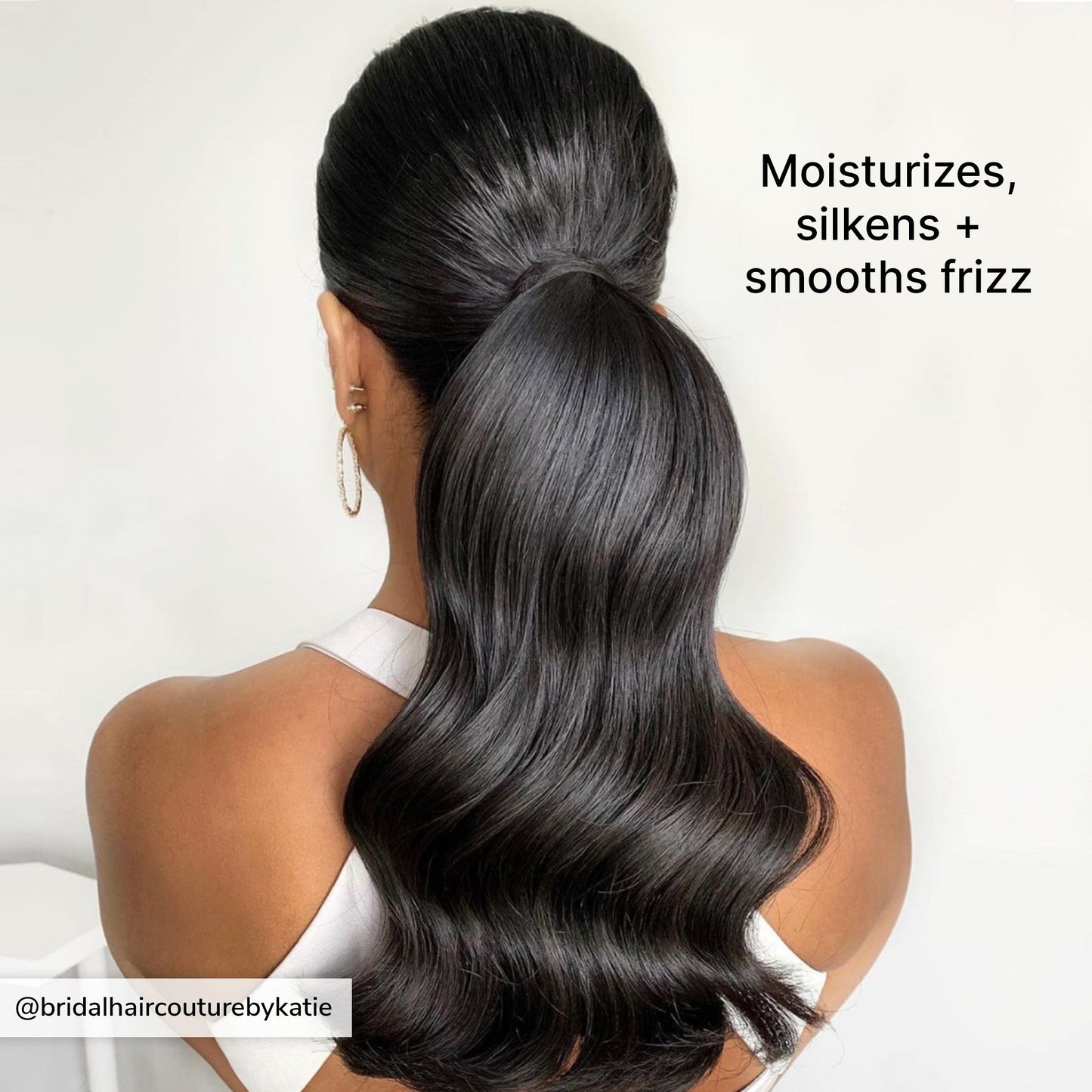 Moisturizes, silkens + smooths frizz. Image from @bridalhaircouturebykatie of a model with a smooth, sleek, glossy ponytail.